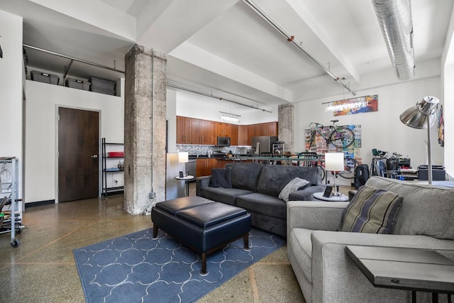 350 Saint Peter St Unit 707, Saint Paul, MN 55102 - living area with light speckled floor, a towering ceiling, and ornate columns