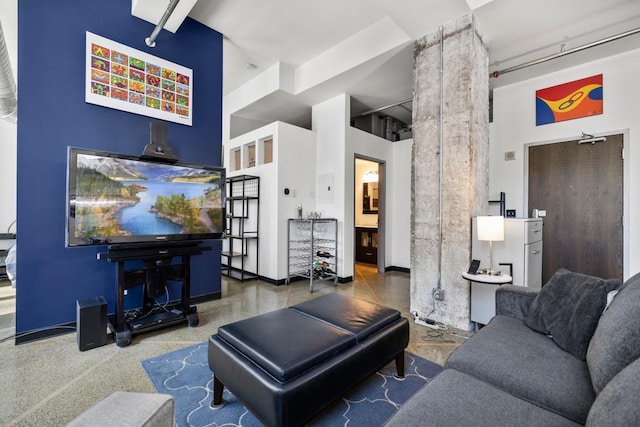 350 Saint Peter St Unit 707, Saint Paul, MN 55102 - living room featuring a high ceiling and baseboards