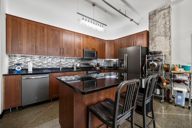 350 Saint Peter St Unit 707, Saint Paul, MN 55102 - kitchen featuring stainless steel appliances, backsplash, a breakfast bar, and a kitchen island