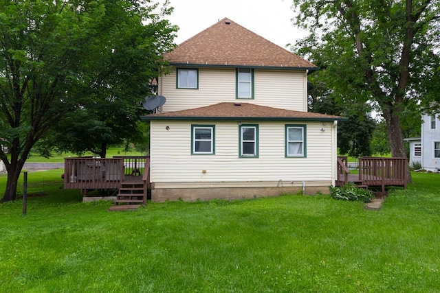 310 4th Ave SW, Hutchinson, MN 55350 - rear view of property with a deck, a shingled roof, and a lawn