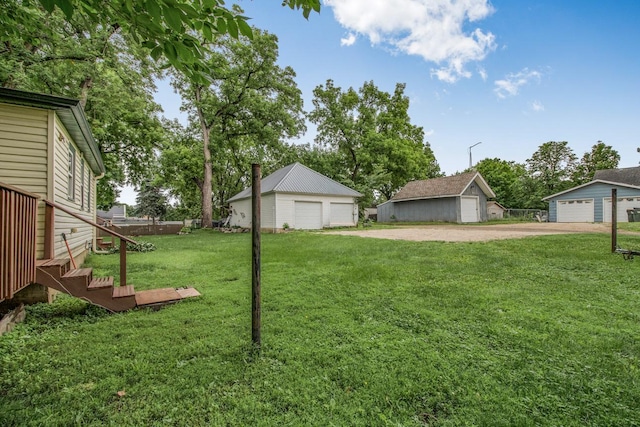 310 4th Ave SW, Hutchinson, MN 55350 - view of green lawn with a detached garage