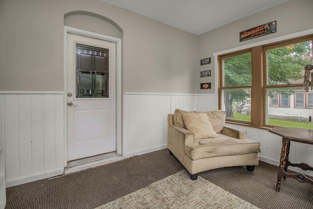 310 4th Ave SW, Hutchinson, MN 55350 - living area with carpet flooring and a wainscoted wall