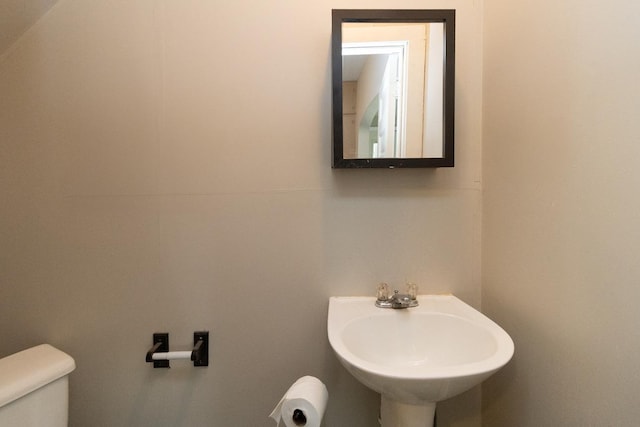310 4th Ave SW, Hutchinson, MN 55350 - half bathroom with toilet and a sink
