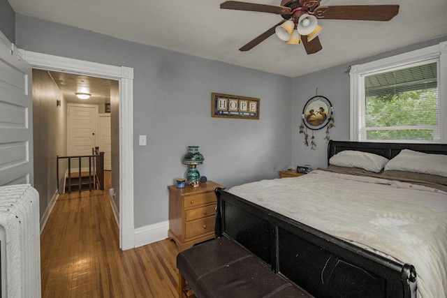 310 4th Ave SW, Hutchinson, MN 55350 - bedroom featuring wood finished floors and a ceiling fan