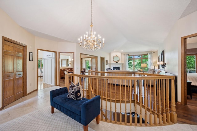 5625 Zachary Ln N, Plymouth, MN 55442 - hall featuring a chandelier, vaulted ceiling, and an upstairs landing