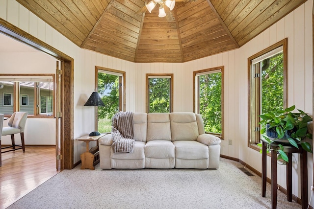 5625 Zachary Ln N, Plymouth, MN 55442 - living area with lofted ceiling, wood ceiling, ceiling fan, and wooden walls