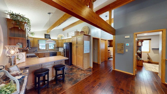 2017 Highland Ave, Albert Lea, MN 56007 - kitchen with black fridge, dishwashing machine, stove, a peninsula, and beamed ceiling
