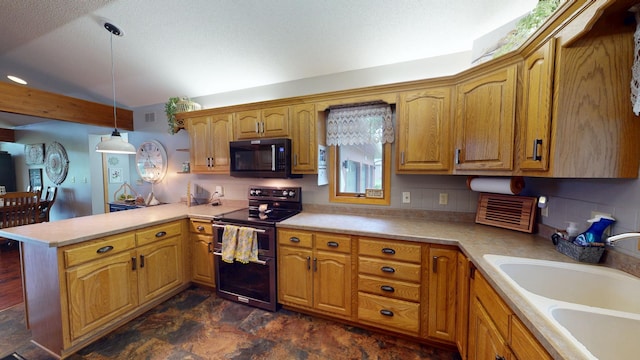 2017 Highland Ave, Albert Lea, MN 56007 - kitchen featuring black microwave, double oven range, a peninsula, and light countertops