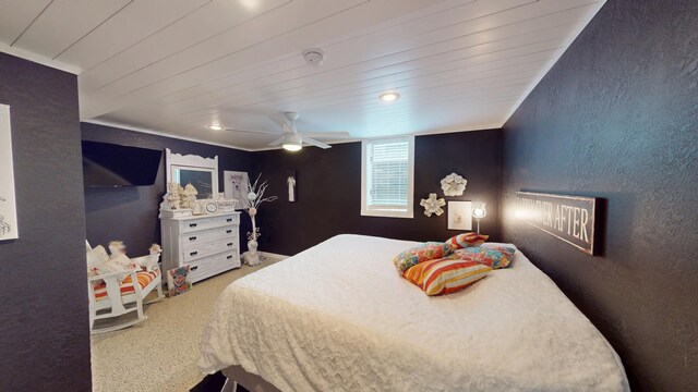 2017 Highland Ave, Albert Lea, MN 56007 - bedroom featuring a textured wall, wood ceiling, ceiling fan, and carpet flooring