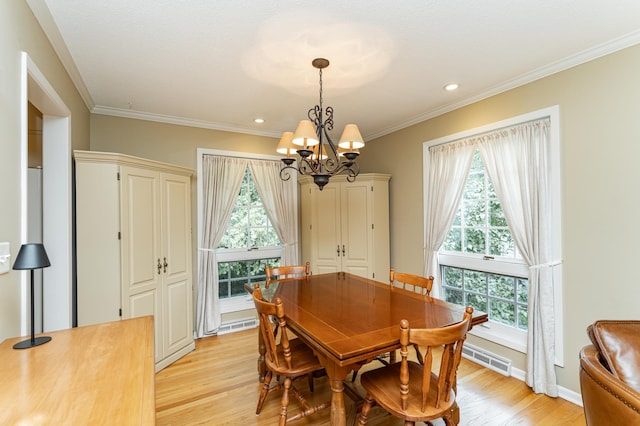 625 Folwell Ln SW, Rochester, MN 55902 - dining area with a chandelier, light wood finished floors, crown molding, and recessed lighting