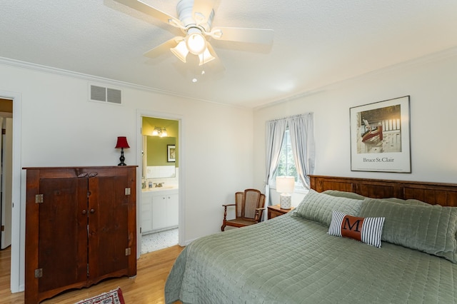 625 Folwell Ln SW, Rochester, MN 55902 - bedroom with ornamental molding, light wood-style flooring, ceiling fan, and ensuite bath