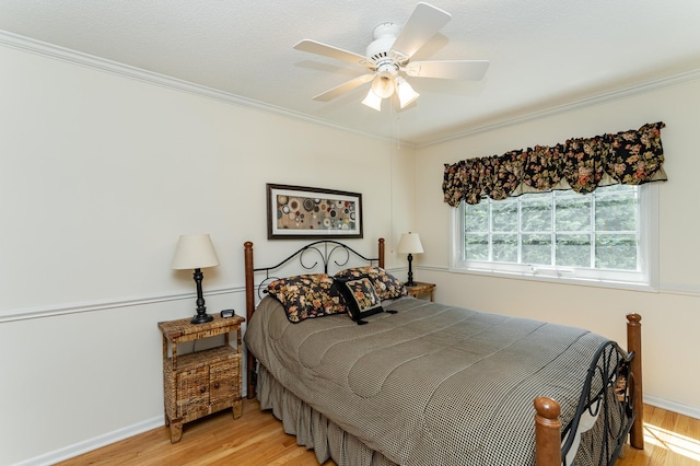 625 Folwell Ln SW, Rochester, MN 55902 - bedroom with light wood-style flooring, ornamental molding, and a ceiling fan
