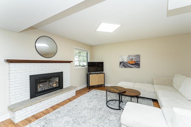 625 Folwell Ln SW, Rochester, MN 55902 - living room with wood finished floors and a brick fireplace