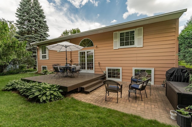 625 Folwell Ln SW, Rochester, MN 55902 - back of house with outdoor dining space, a deck, a patio area, and a yard