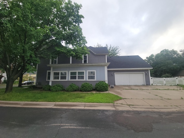 302 3rd St W, Hastings, MN 55033 - view of front facade featuring an attached garage, driveway, and a gate