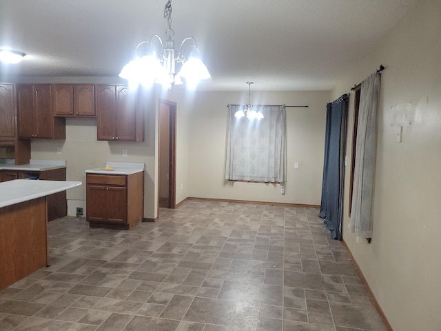 302 3rd St W, Hastings, MN 55033 - kitchen with a chandelier, hanging light fixtures, light countertops, and brown cabinets