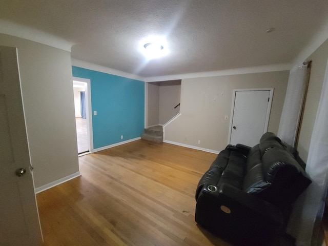 302 3rd St W, Hastings, MN 55033 - living room with light wood-style flooring, stairs, and a textured ceiling