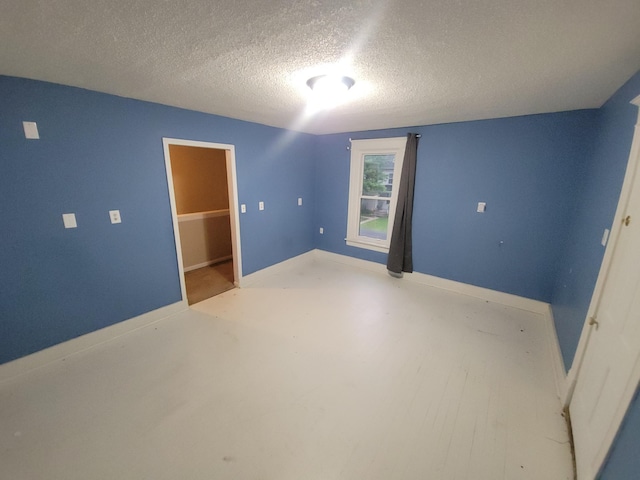 302 3rd St W, Hastings, MN 55033 - spare room featuring a textured ceiling and baseboards