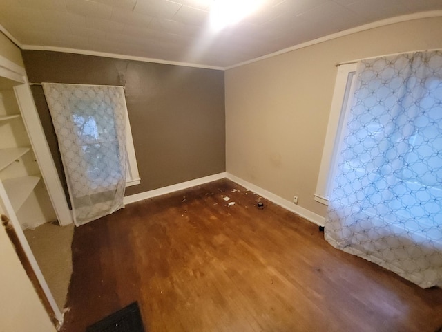 302 3rd St W, Hastings, MN 55033 - spare room with crown molding and wood finished floors