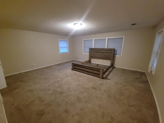 302 3rd St W, Hastings, MN 55033 - unfurnished bedroom featuring baseboards and carpet