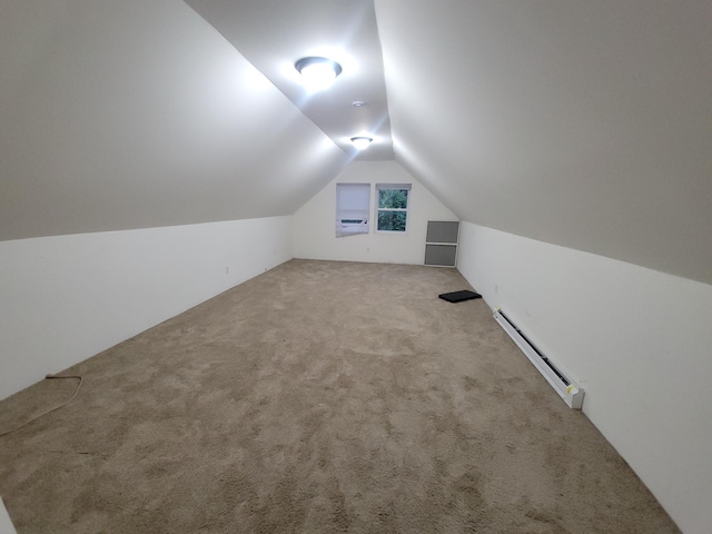 302 3rd St W, Hastings, MN 55033 - additional living space with baseboard heating, vaulted ceiling, and carpet