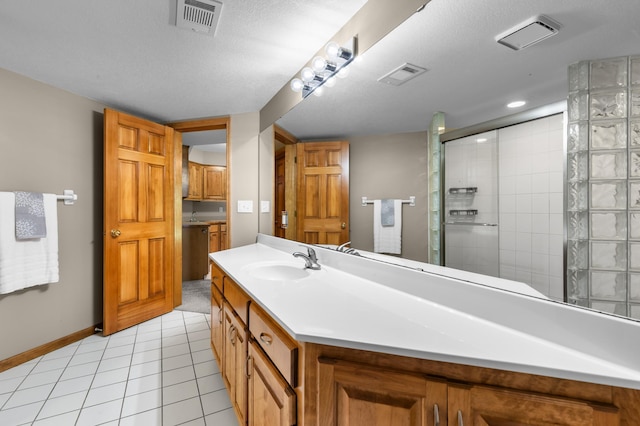 6354 Oxbow Bnd, Chanhassen, MN 55317 - full bath featuring tiled shower, vanity, and tile patterned flooring