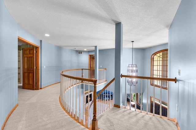 6354 Oxbow Bnd, Chanhassen, MN 55317 - corridor with an upstairs landing, carpet flooring, a textured ceiling, recessed lighting, and a chandelier