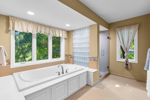 6354 Oxbow Bnd, Chanhassen, MN 55317 - bathroom featuring a bath, a stall shower, and recessed lighting