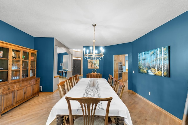 6354 Oxbow Bnd, Chanhassen, MN 55317 - dining space featuring a chandelier and light wood finished floors