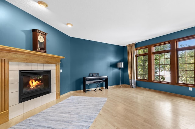 6354 Oxbow Bnd, Chanhassen, MN 55317 - living area featuring a tiled fireplace and wood finished floors