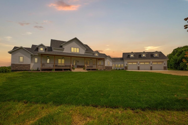 13827 Halstad Ave, Lonsdale, MN 55046 - view of front of house featuring a porch, driveway, a front lawn, and stone siding