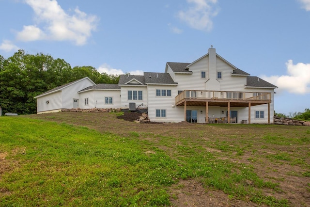 13827 Halstad Ave, Lonsdale, MN 55046 - rear view of house with a deck and a lawn