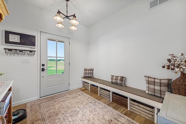 13827 Halstad Ave, Lonsdale, MN 55046 - mudroom featuring a chandelier and wood finished floors