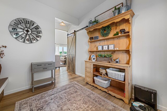 13827 Halstad Ave, Lonsdale, MN 55046 - office area with a barn door and light wood-style floors