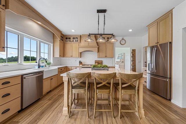 13827 Halstad Ave, Lonsdale, MN 55046 - kitchen with stainless steel appliances, light countertops, light brown cabinets, light wood finished floors, and recessed lighting