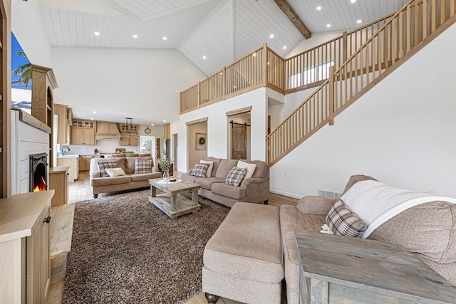 13827 Halstad Ave, Lonsdale, MN 55046 - living room with recessed lighting, high vaulted ceiling, beam ceiling, and wood finished floors