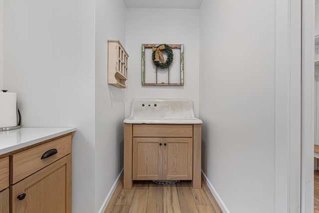 13827 Halstad Ave, Lonsdale, MN 55046 - bathroom with wood finished floors and vanity