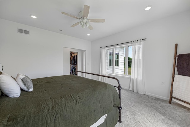 13827 Halstad Ave, Lonsdale, MN 55046 - bedroom with light carpet, recessed lighting, a walk in closet, ceiling fan, and a closet