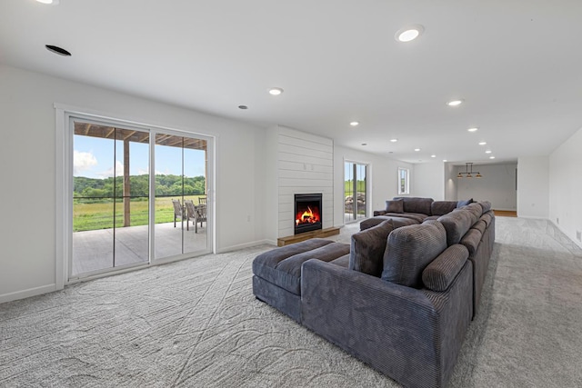 13827 Halstad Ave, Lonsdale, MN 55046 - living area featuring carpet floors, a fireplace, and recessed lighting