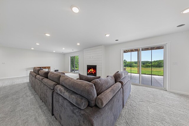 13827 Halstad Ave, Lonsdale, MN 55046 - living room with light colored carpet, recessed lighting, and a fireplace