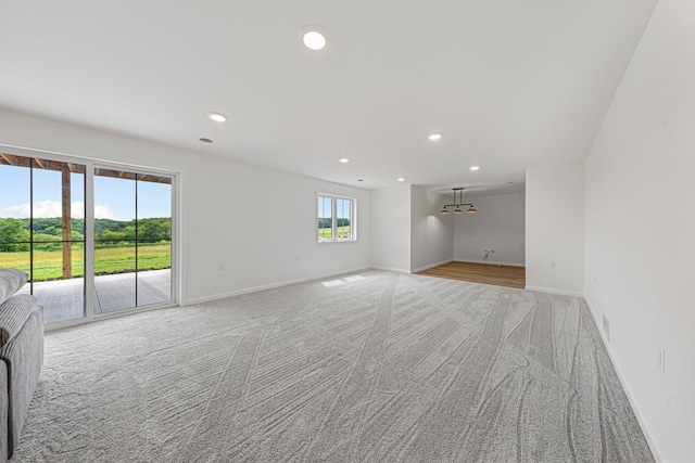 13827 Halstad Ave, Lonsdale, MN 55046 - empty room with light carpet and recessed lighting