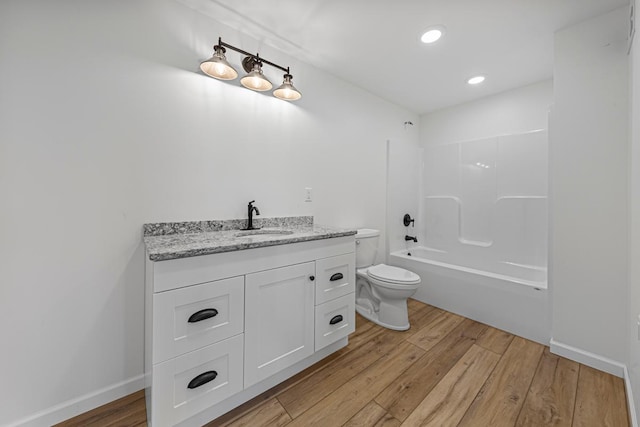13827 Halstad Ave, Lonsdale, MN 55046 - bathroom with vanity, wood finished floors, bathing tub / shower combination, and recessed lighting