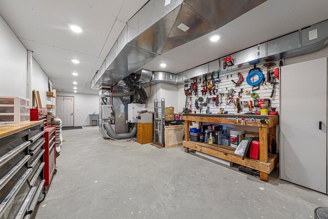 13827 Halstad Ave, Lonsdale, MN 55046 - below grade area featuring a workshop area, heating unit, and recessed lighting