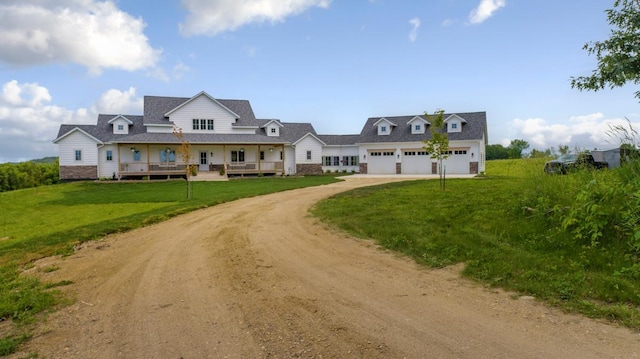 13827 Halstad Ave, Lonsdale, MN 55046 - view of front of home with driveway, a garage, and a front yard