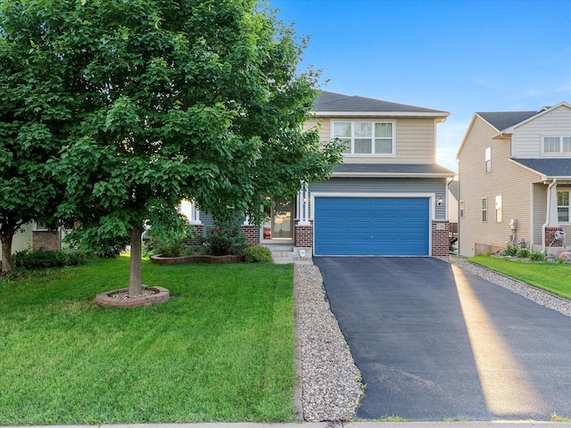 1788 Fescue Ct, Shakopee, MN 55379 - view of front facade with brick siding, a garage, asphalt driveway, and a front lawn
