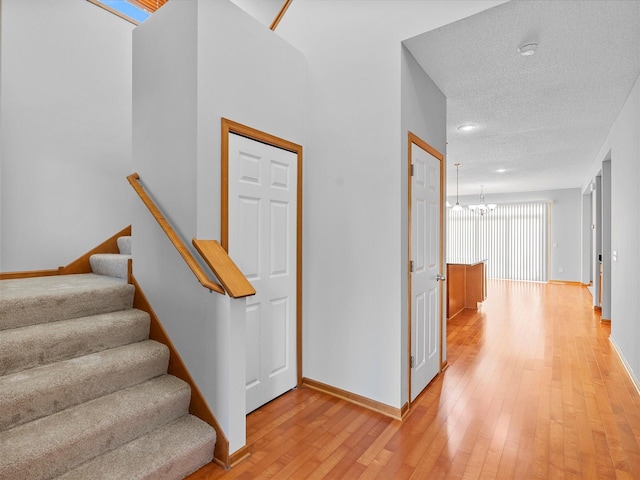 1788 Fescue Ct, Shakopee, MN 55379 - staircase with a chandelier, hardwood / wood-style flooring, and recessed lighting