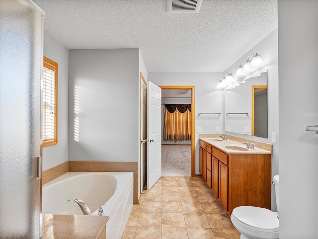 1788 Fescue Ct, Shakopee, MN 55379 - full bath featuring a garden tub, double vanity, and a textured ceiling