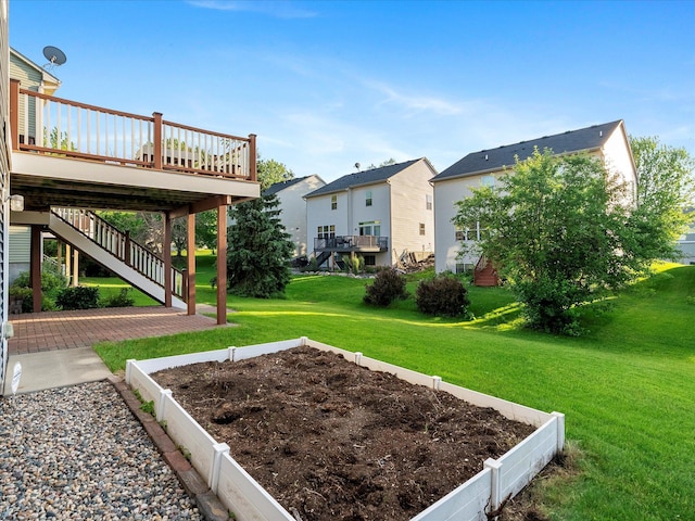 1788 Fescue Ct, Shakopee, MN 55379 - view of green lawn with a garden, a deck, stairs, and a residential view