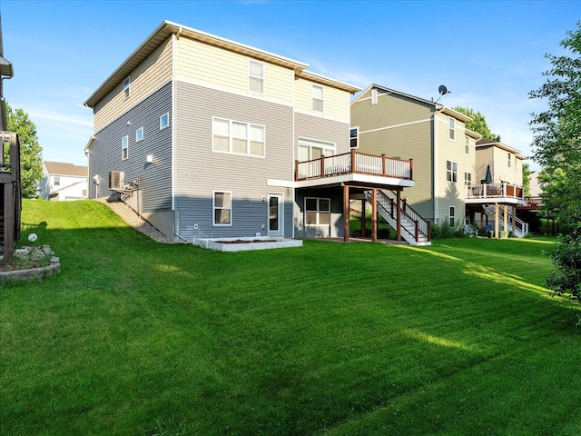 1788 Fescue Ct, Shakopee, MN 55379 - back of house with stairway, a deck, and a lawn
