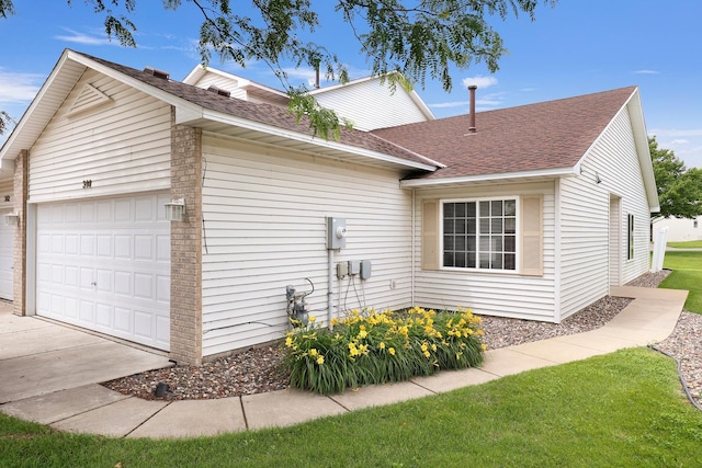 314 Archibald Ln, Dundas, MN 55019 - view of property exterior featuring roof with shingles, a garage, and driveway